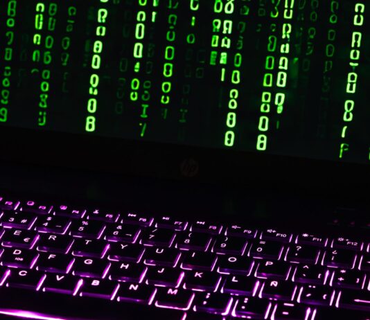 Matrix-inspired code on a laptop keyboard