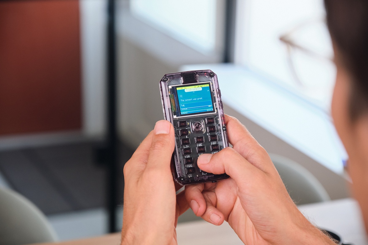 MAKERphone 2.0 Launches on Kickstarter: a Real 4G Phone You Build in Two Hours and Code with AI 1 A man using a MAKERphone 2.0 mobile phone.