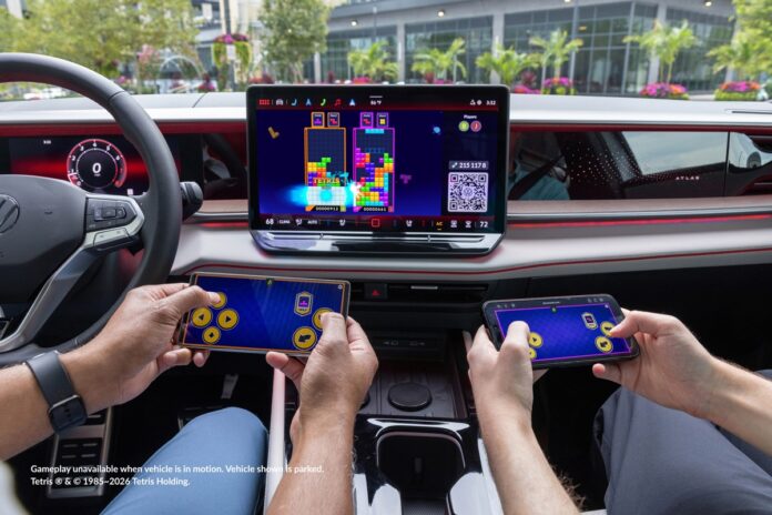 Two people playing Tetris with AirConsole In-Car Gaming in a Volkswagen Atlas